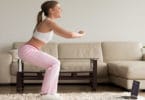 4 minute workout image of young woman squatting