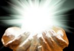 Spiritual light in cupped hands